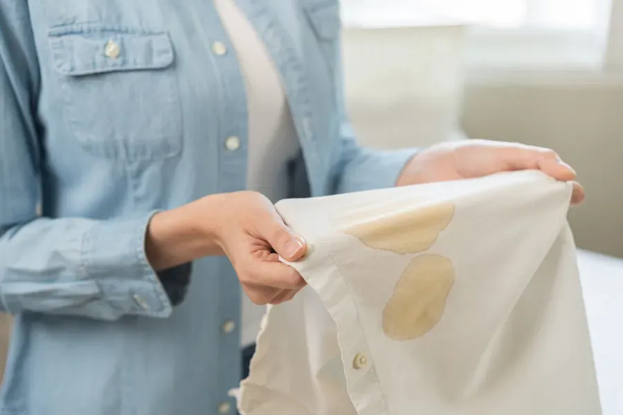 woman-holding-stained-white-shirt